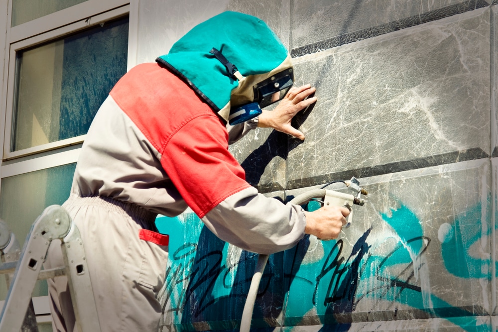 Cleaning,Graffiti,From,A,Building,Wall
